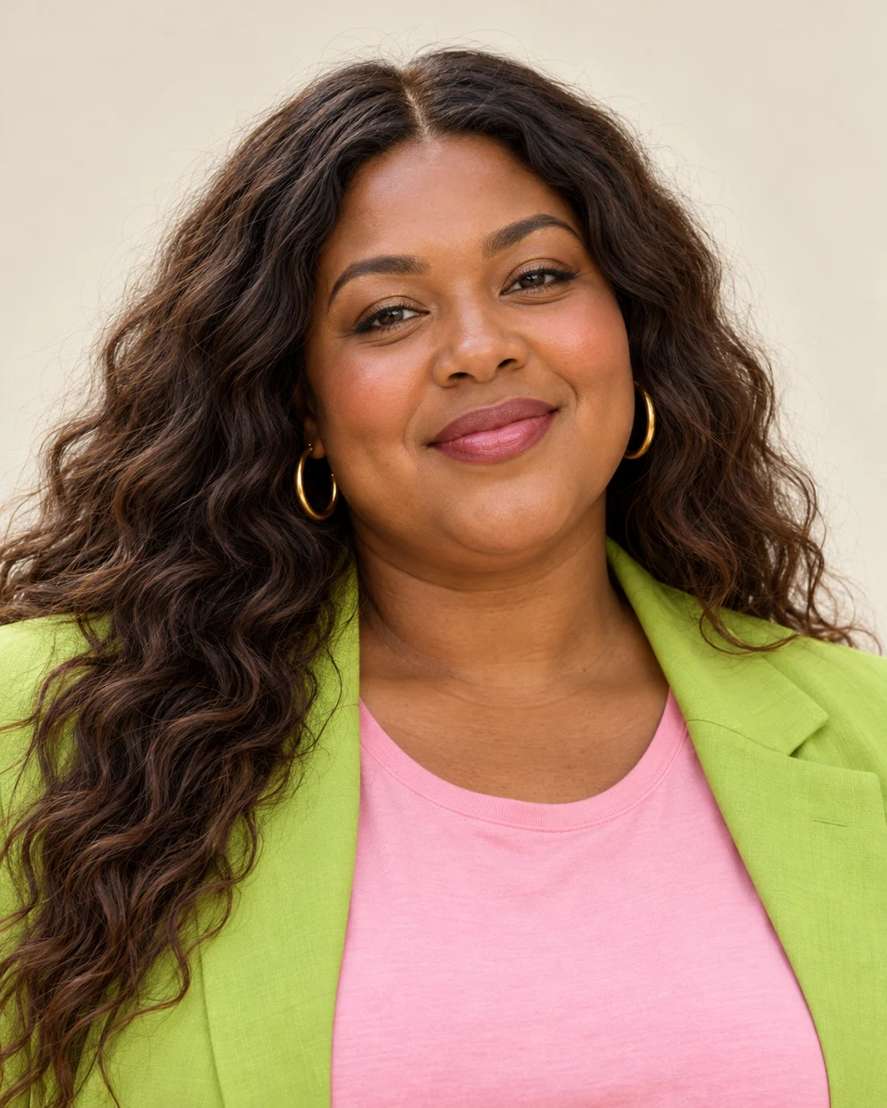 A fictional woman with warm brown skin, dark waves and full facial proportions wearing contained gold lids, narrow brown lash definition, warm rose cheeks and berry lips beside lime and pink.